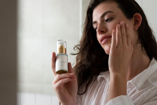 woman applying facial serum oil loveskin product