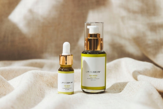 Loveskin Kiri aroha facial serum oils on muslin cloth background
