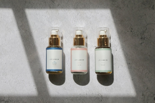loveskin 3 step ritual bottles laying on marble background