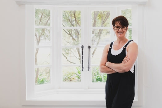 LOVESKIN NZ founder, Joanna Lehndorf, standing by window