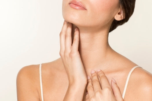 woman caressing her hydrated neck skin