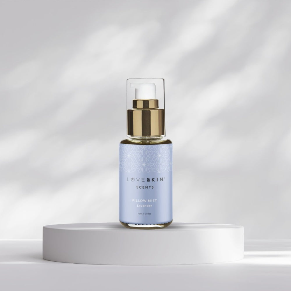 LoveSkin Scents Pillow Mist Lavender spray bottle on platform against soft grey background