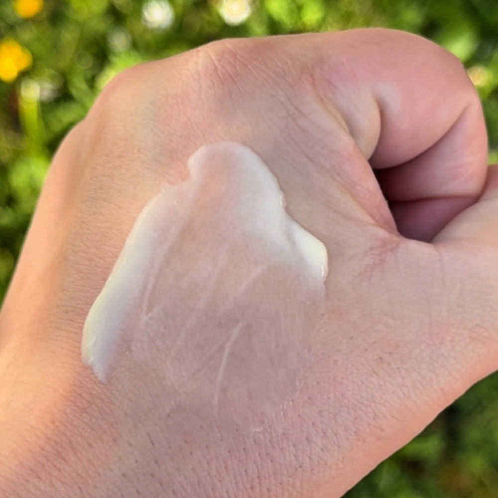 Coconut Mango Hand Lotion buttery texture shown on hand