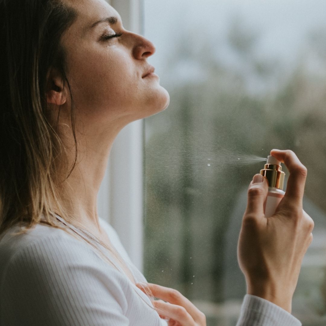 Woman spraying the Kakara rose facial toner