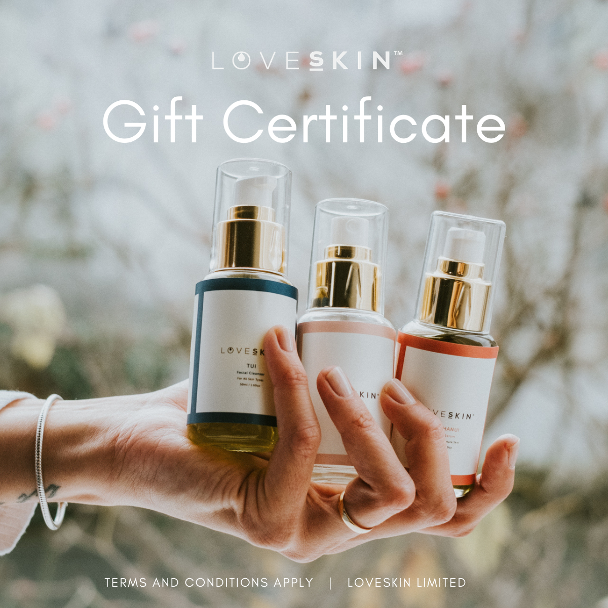 A gift certificate image featuring a person holding three LOVESKINNZ skincare product bottles in a natural setting.