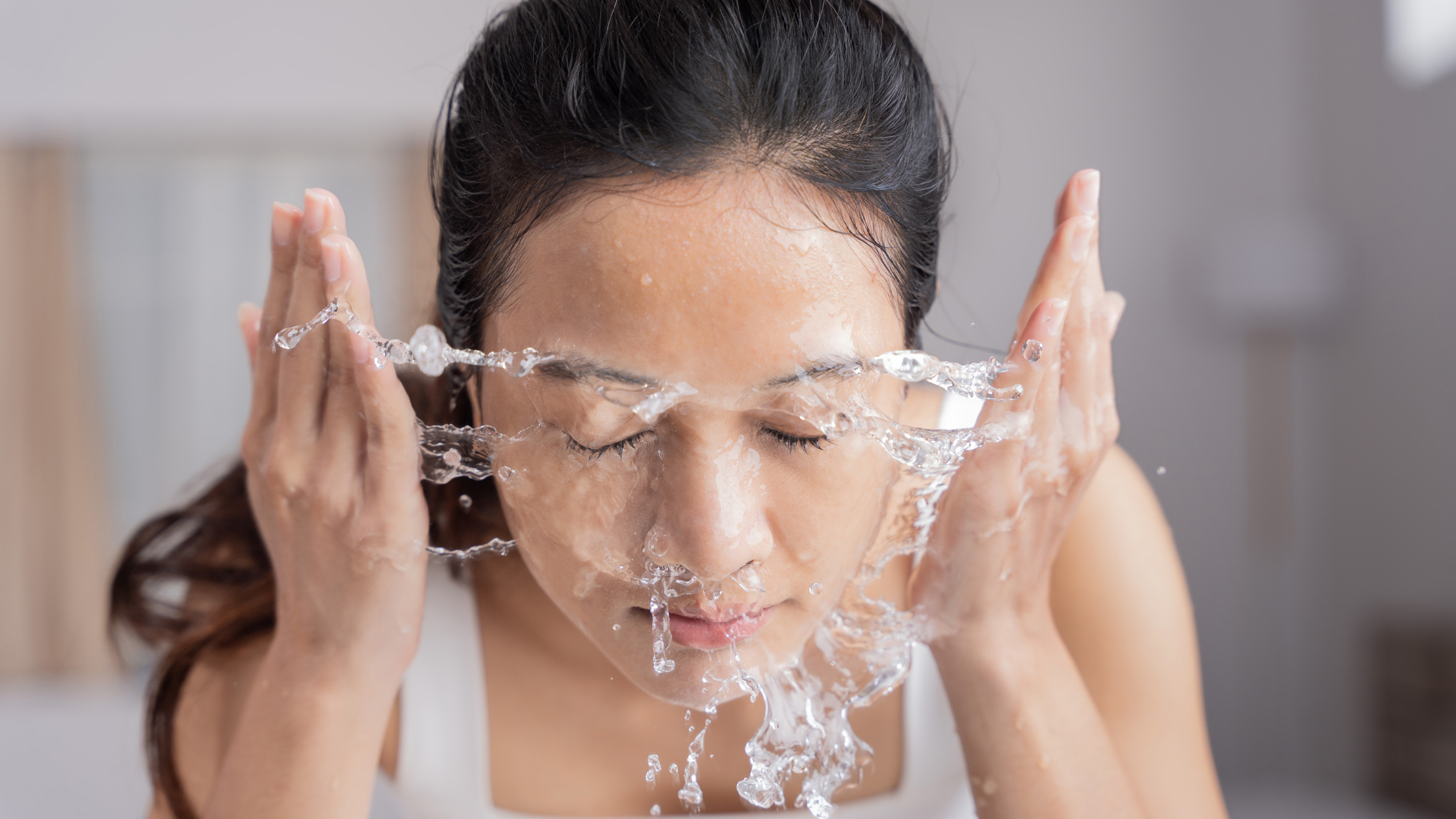 Washing your face with soap to manage acne