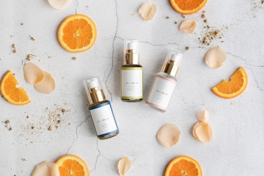 3-step skincare ritual laid out with orange and rose petals