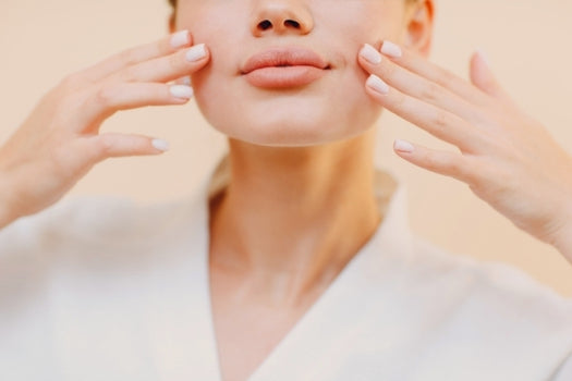 Woman doing facial stretches and yoga for skin health