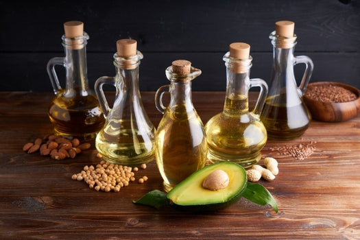 selection of different cooking oils in jars