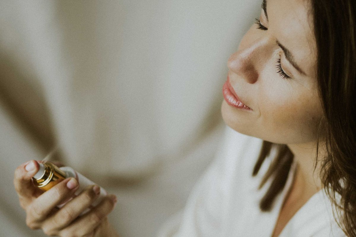 Woman using hydrating spray