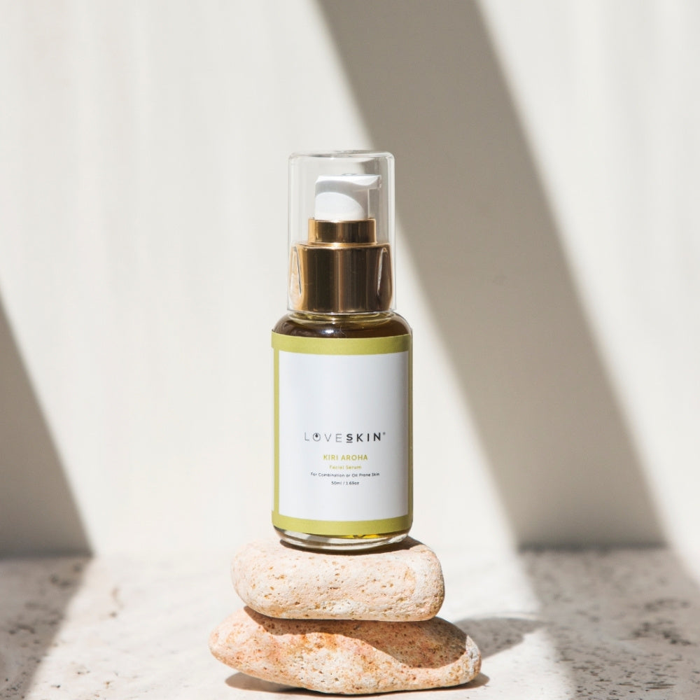 Bottle of Kiri Aroha Facial Serum by LoveSkin, on a stone with plain background NZ natural skincare