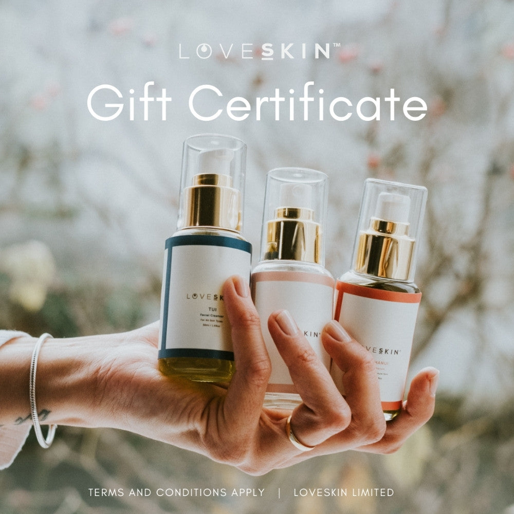 A gift certificate featuring a person holding three LOVESKIN NZ skincare product bottles in a natural setting.