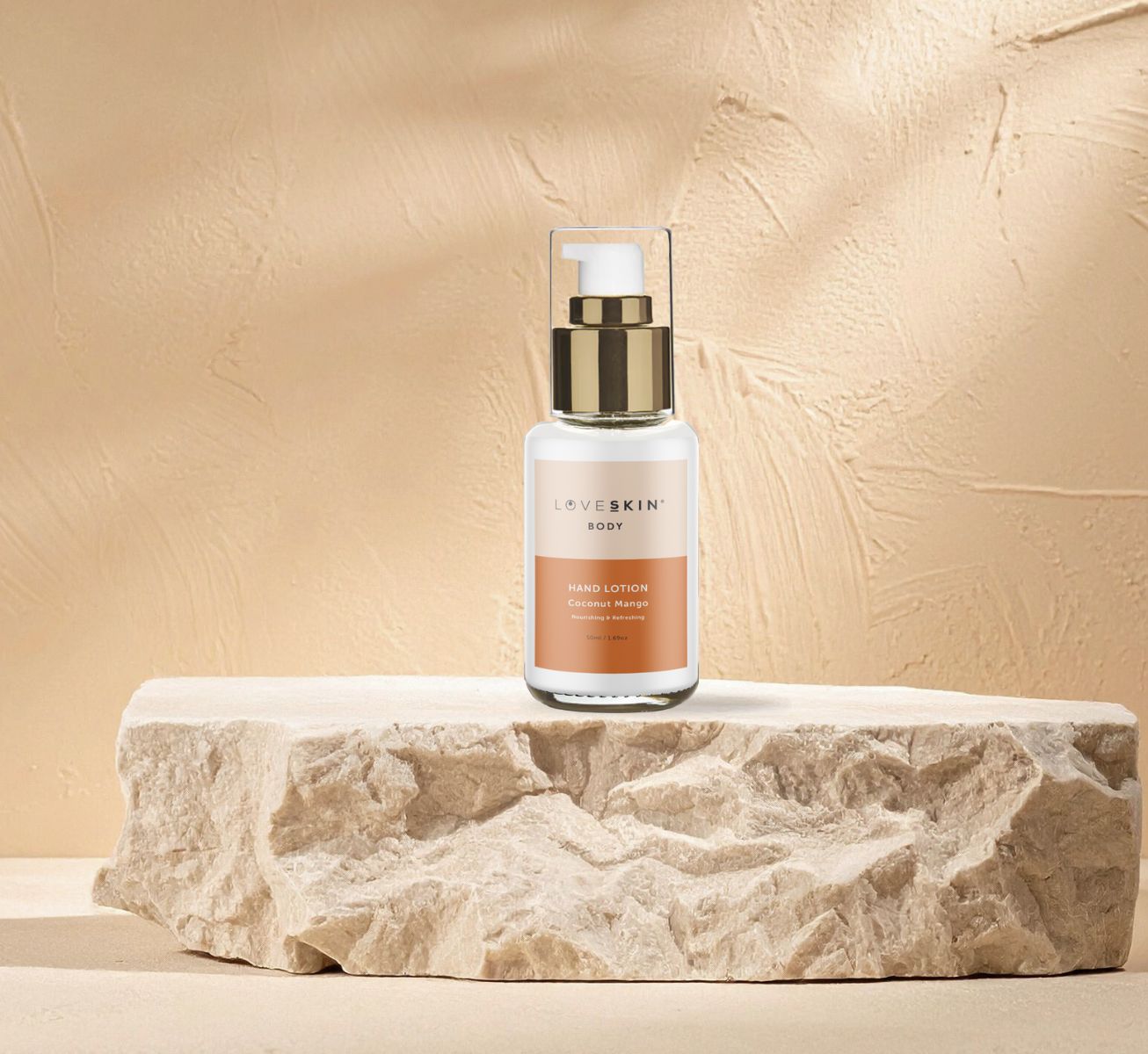 Image of a bottle of coconut and mango hand lotion, a non-greasy and hydrating hand cream for soft, nourished skin.