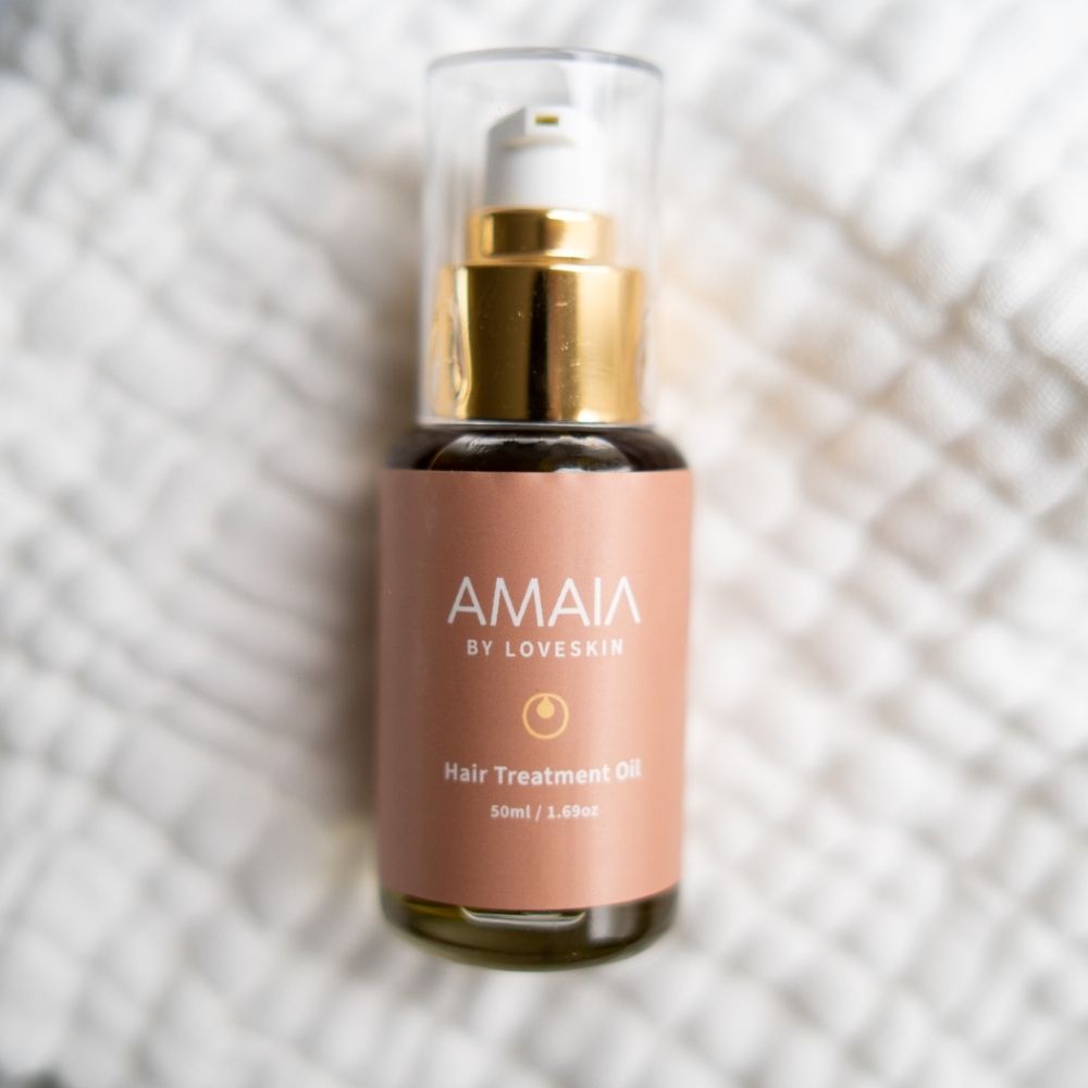 Nourishing hair oil treatment with rosemary, jojoba oil, and argan oil for coarse, dry, or thick hair types.