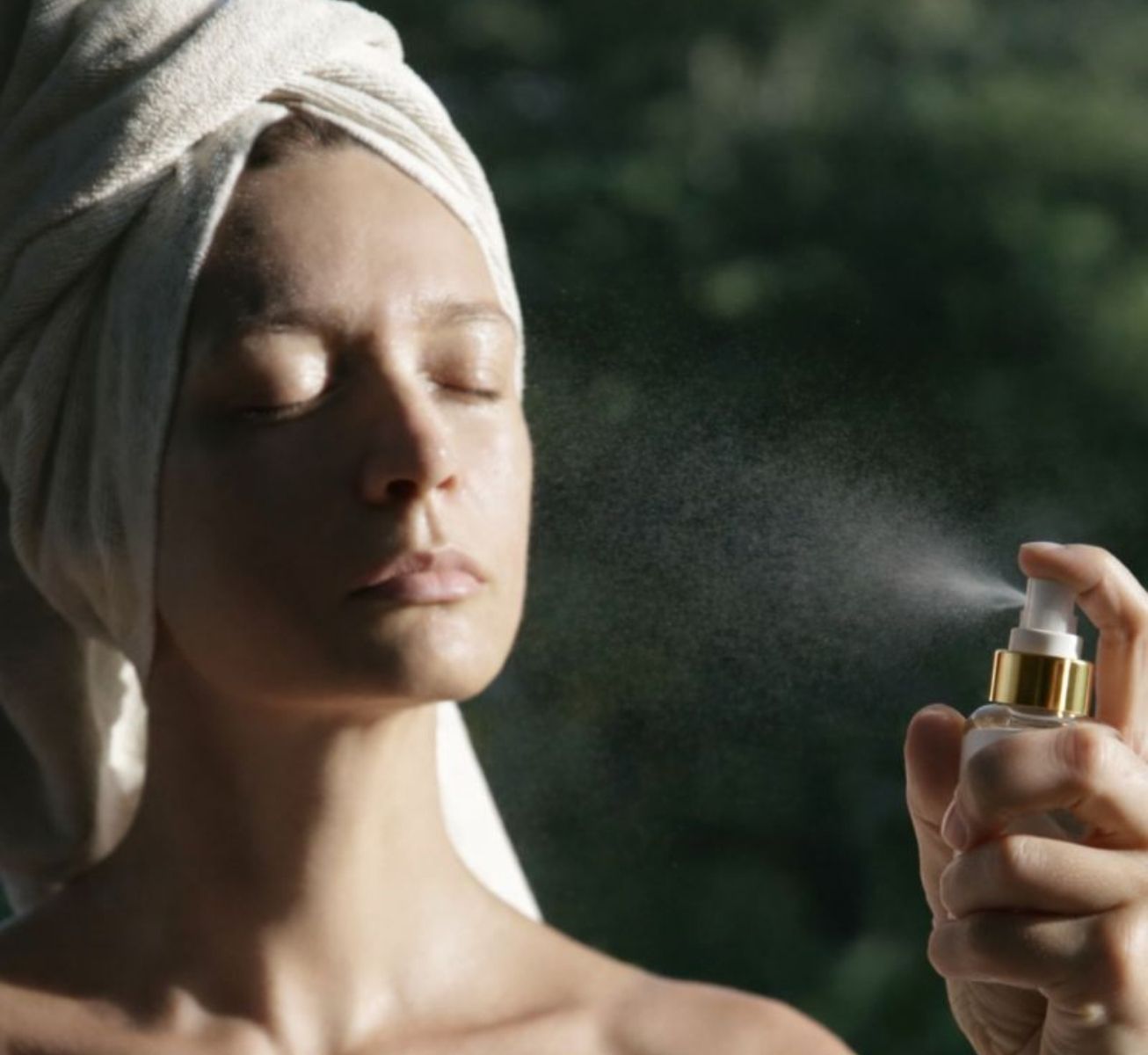 LoveSkin Cooling Comfort Mist for face and body, shown in use as a refreshing facial mist.